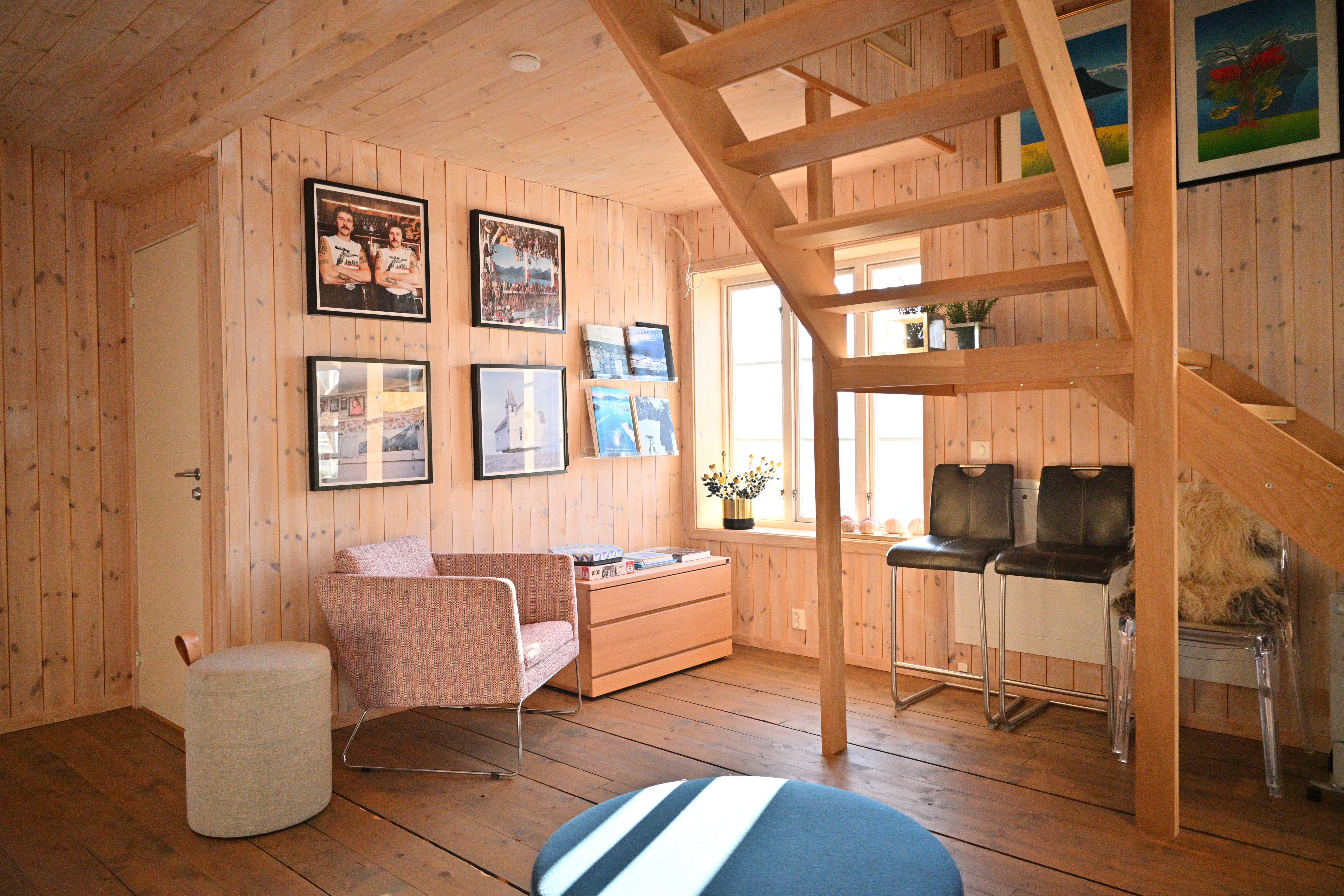 A spacious open air mountain reading nook and staircase at Arctic Coliving in Henningsvær in Lofoten in Arctic Norway