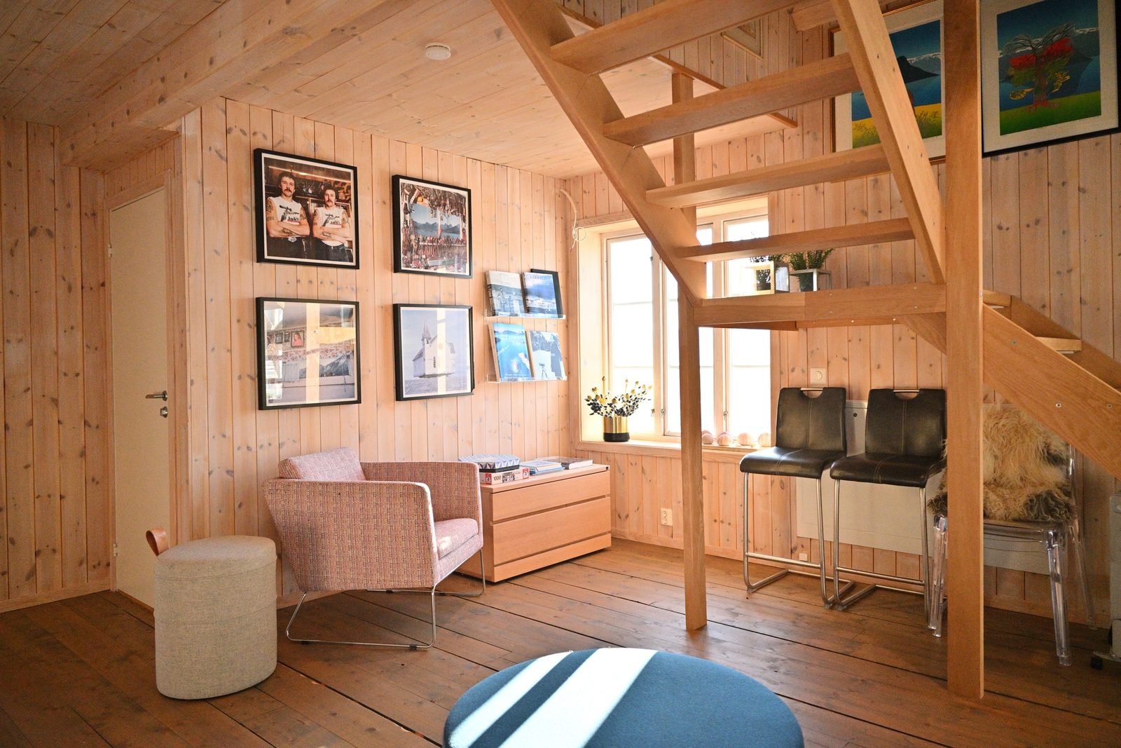 A spacious open air mountain reading nook and staircase at Arctic Coliving in Henningsvær in Lofoten in Arctic Norway
