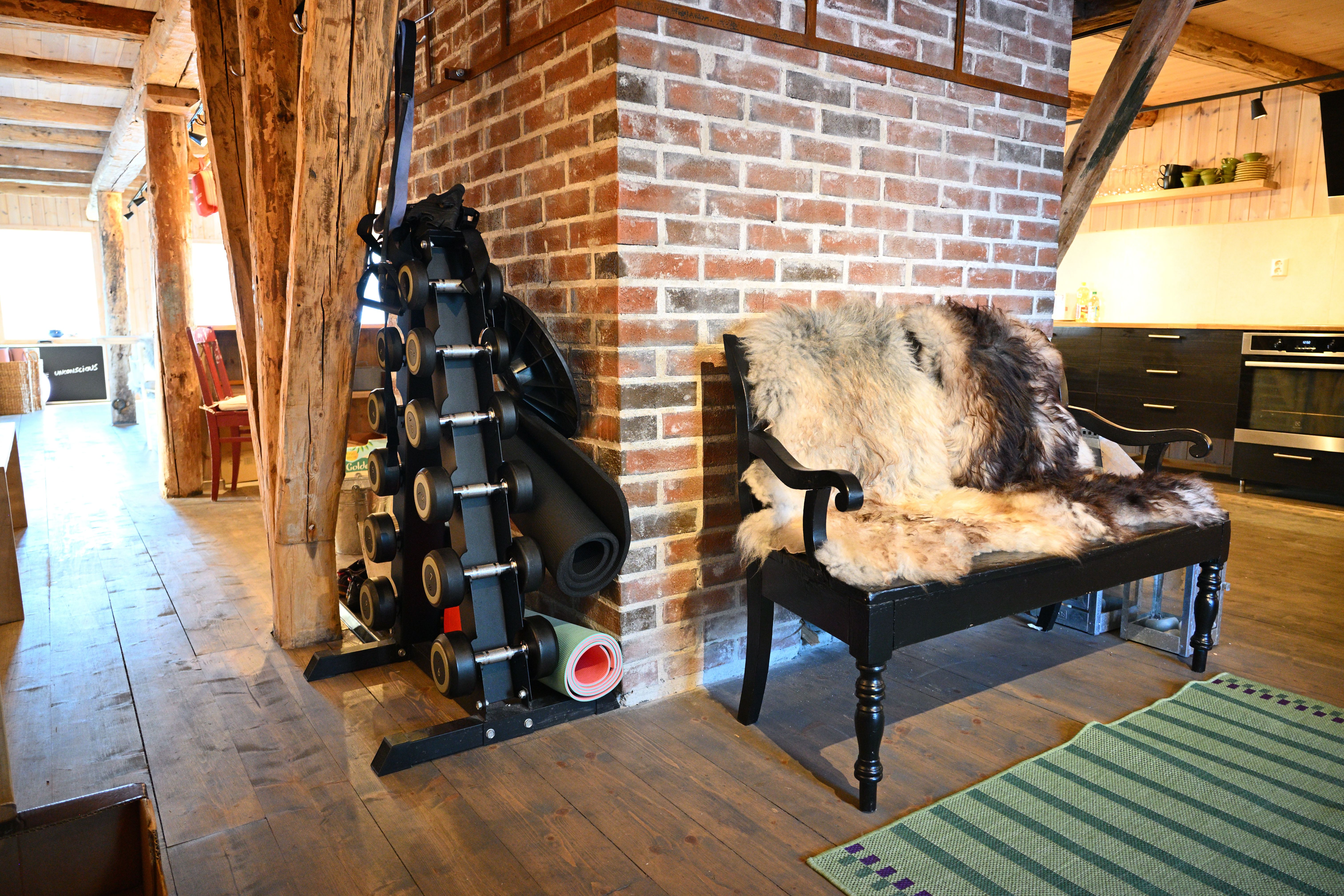 An open air mountain lodge and exercise weights at Arctic Coliving in Henningsvær in Lofoten in Arctic Norway