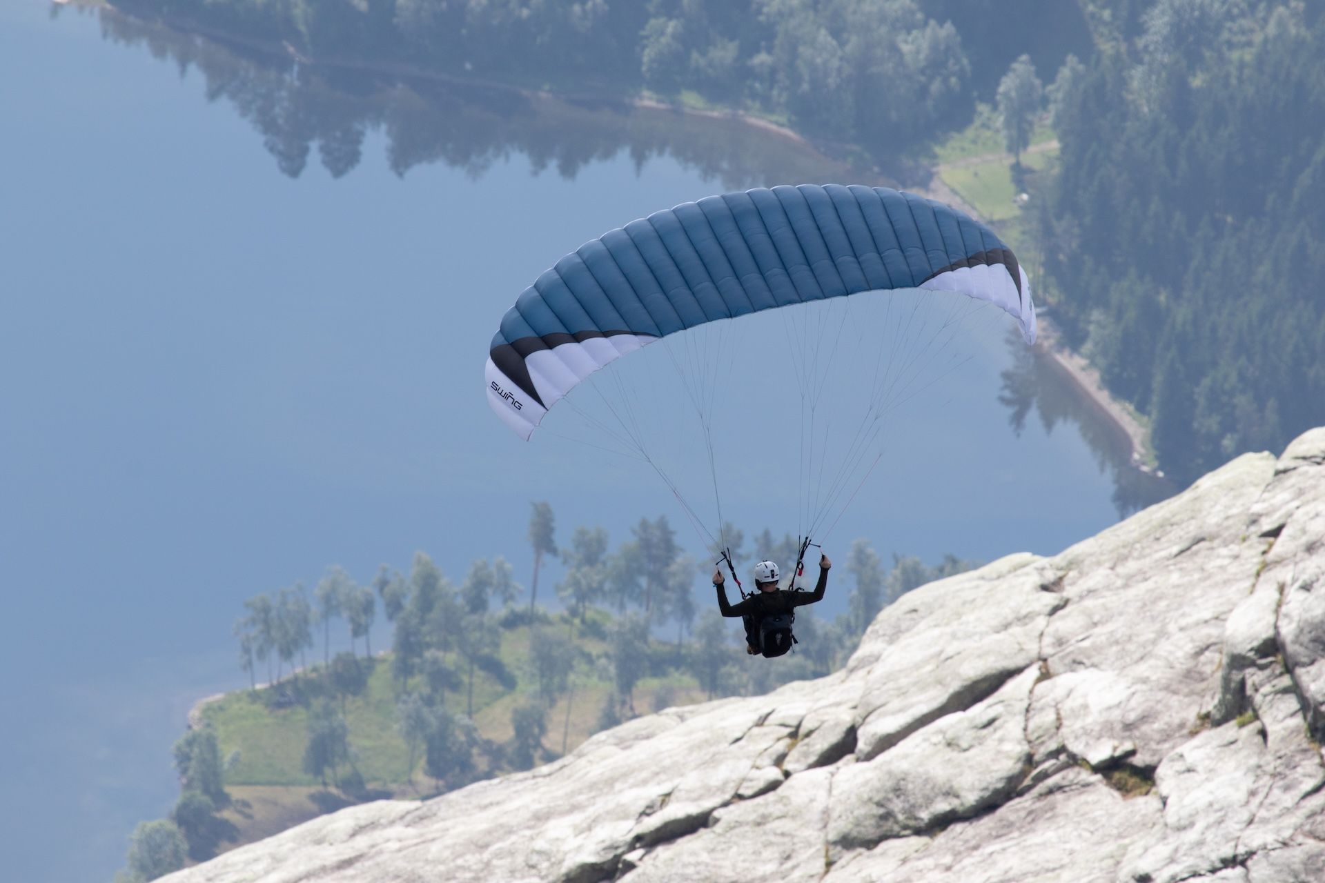 A paraglider in the mountains of Voss Norway during Ekstremsportsveko festival