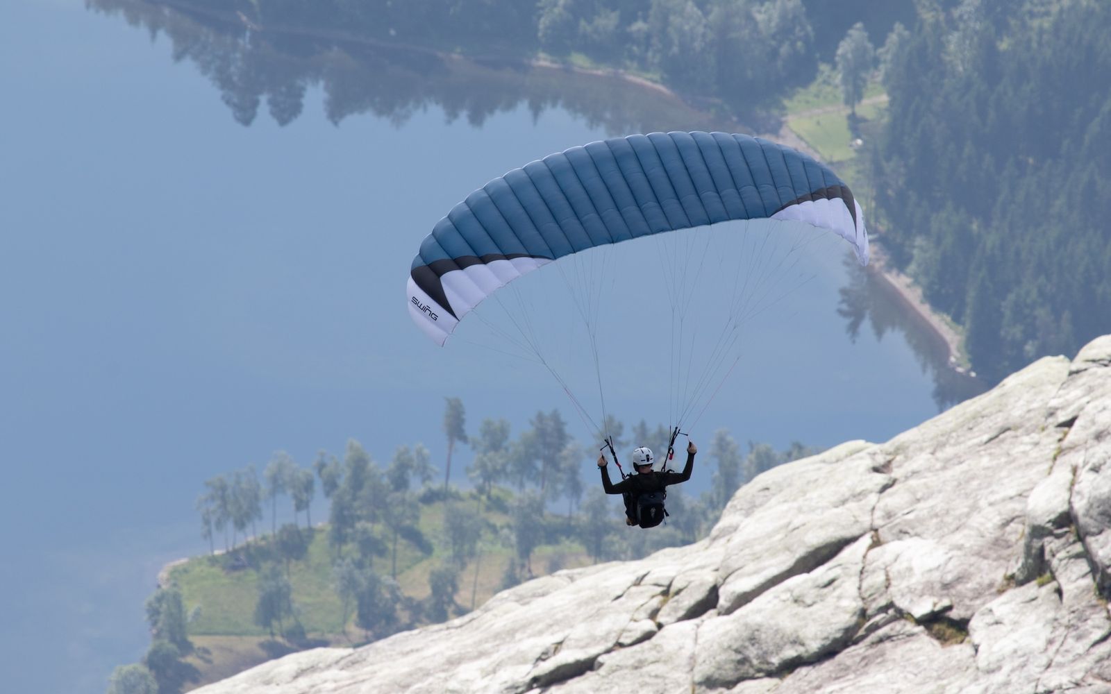 A paraglider in the mountains of Voss Norway during Ekstremsportsveko festival