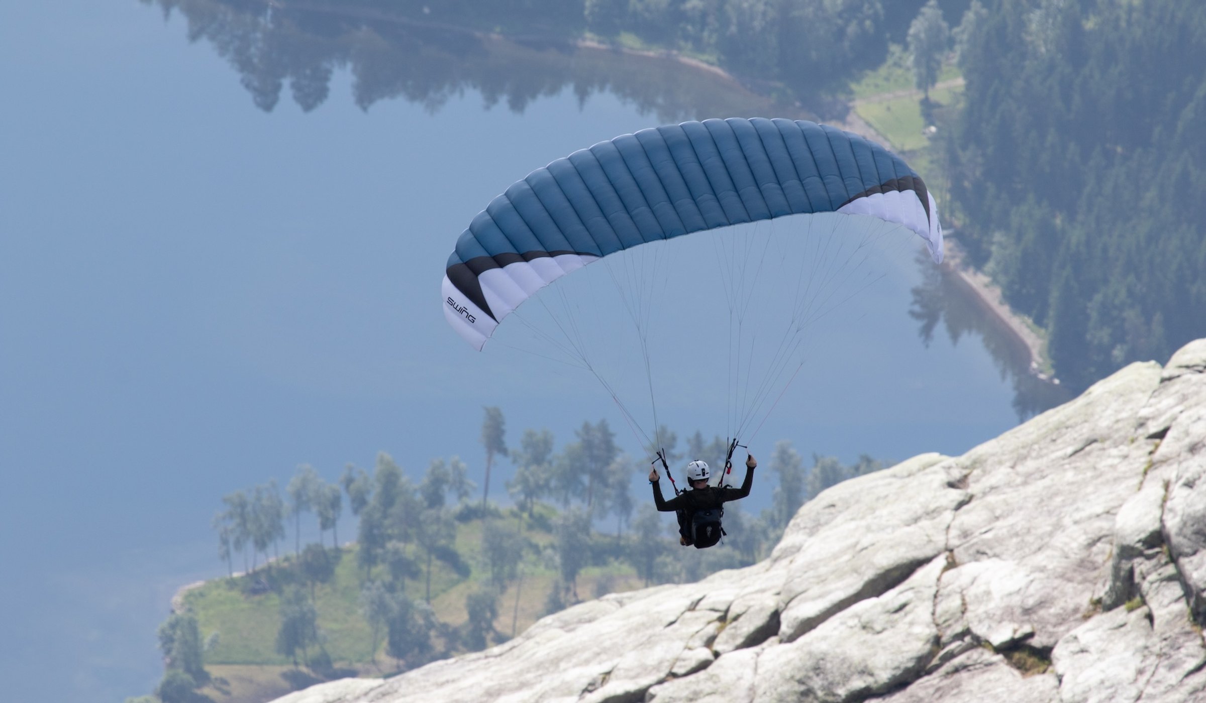A paraglider in the mountains of Voss Norway during Ekstremsportsveko festival