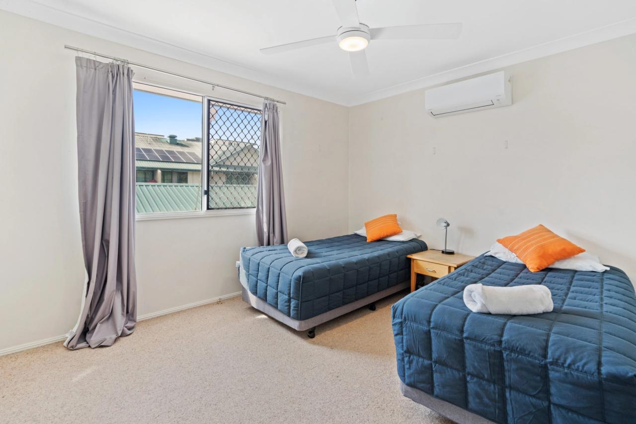 Motel room with queen bed