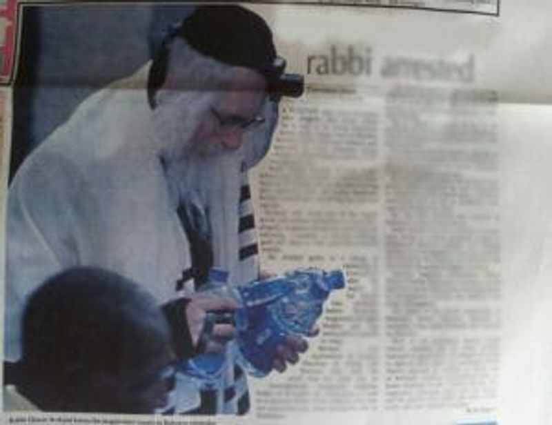 Rabbi Berland arrested handcuffs