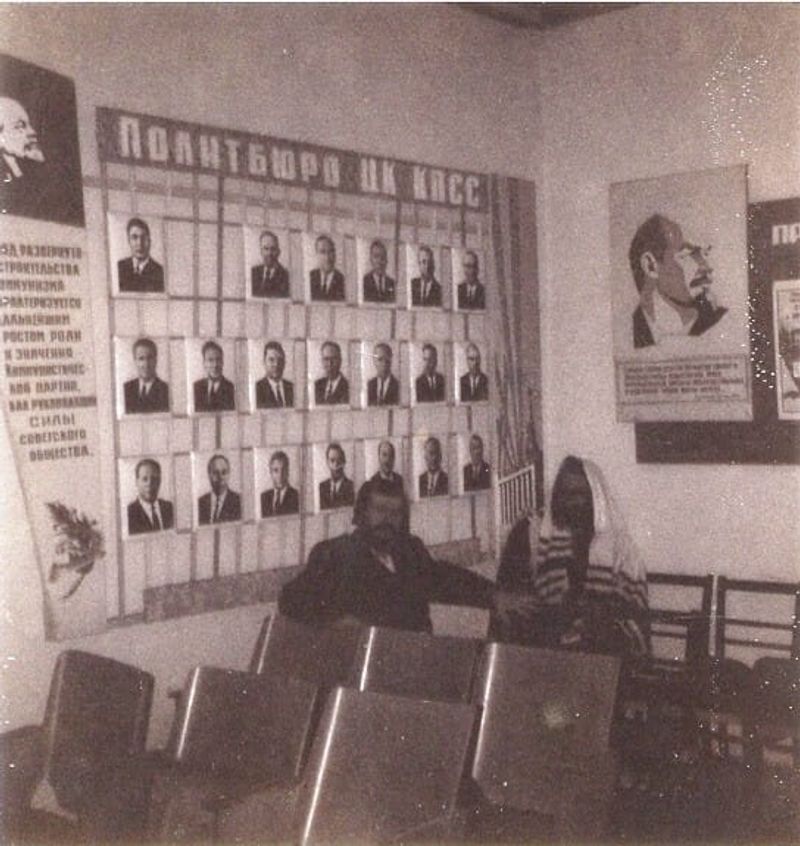 Rav Berland at the KGB offices with Lenins picture in the background