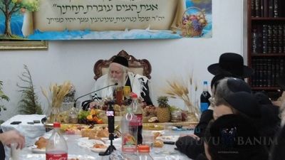 Rabbi Eliezer Berland Shlit"a with Table Set for Tu B'Shevat in his Home