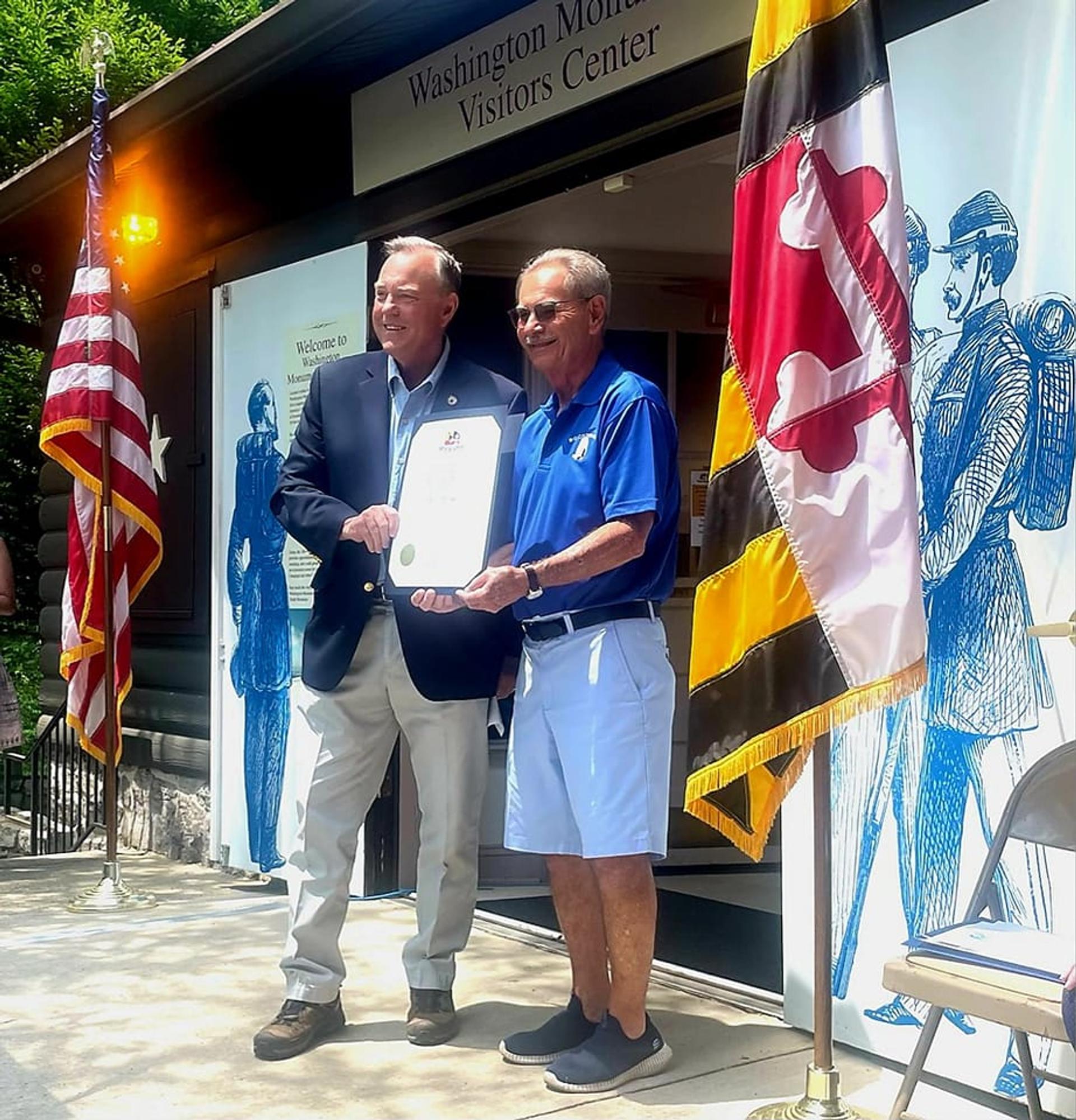 Image of DeputySecretary Riford presenting citation