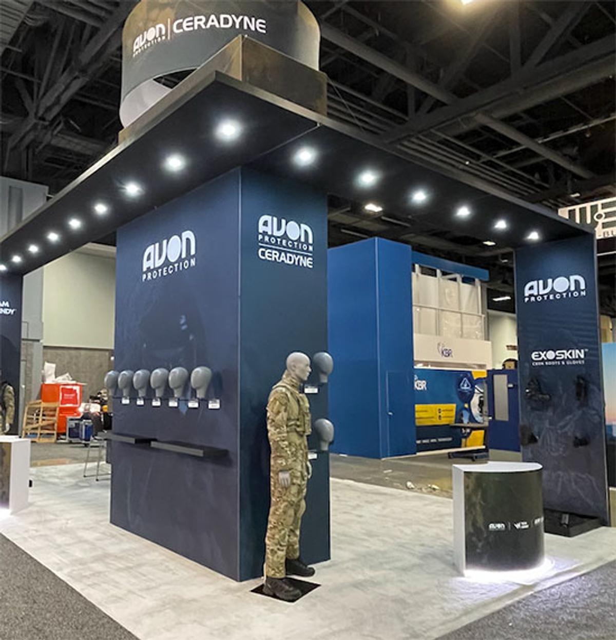 A tradeshow booth with mannequin wearing military uniform 