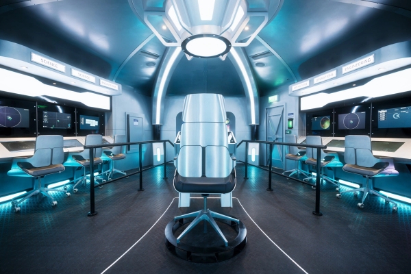Spaceship command bridge set featuring a central pilot chair and futuristic terminal screens, available for film hire through Love Locations.
