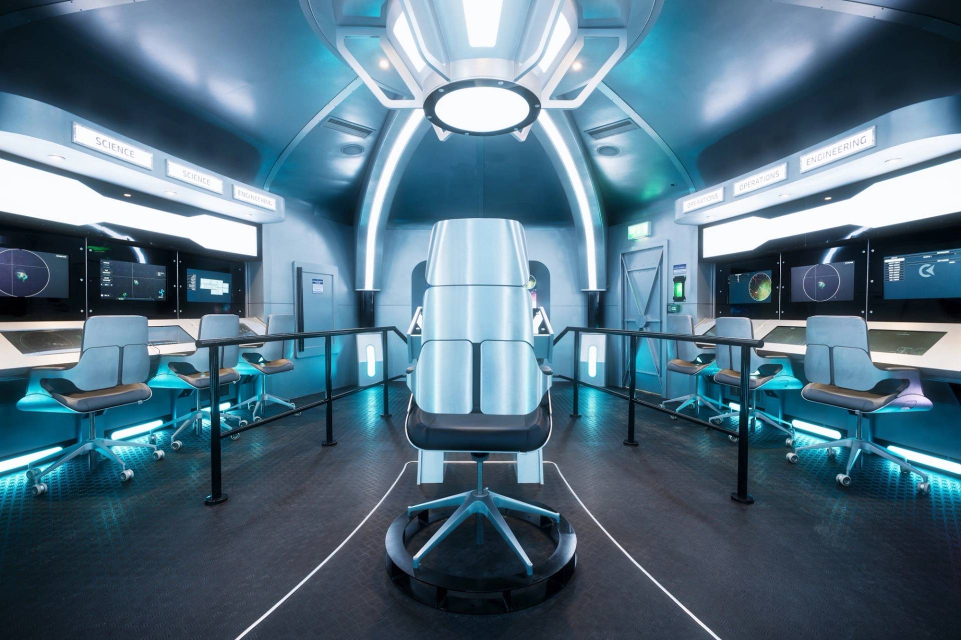Spaceship command bridge set featuring a central pilot chair and futuristic terminal screens, available for film hire through Love Locations.