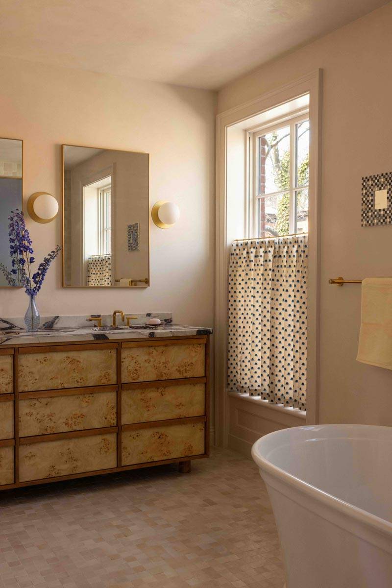 Modern secondary bathroom location with a woven wooden dresser vanity and sheer window cafe curtains in Boerum Hill Brooklyn NY 11217 from Love Locations.