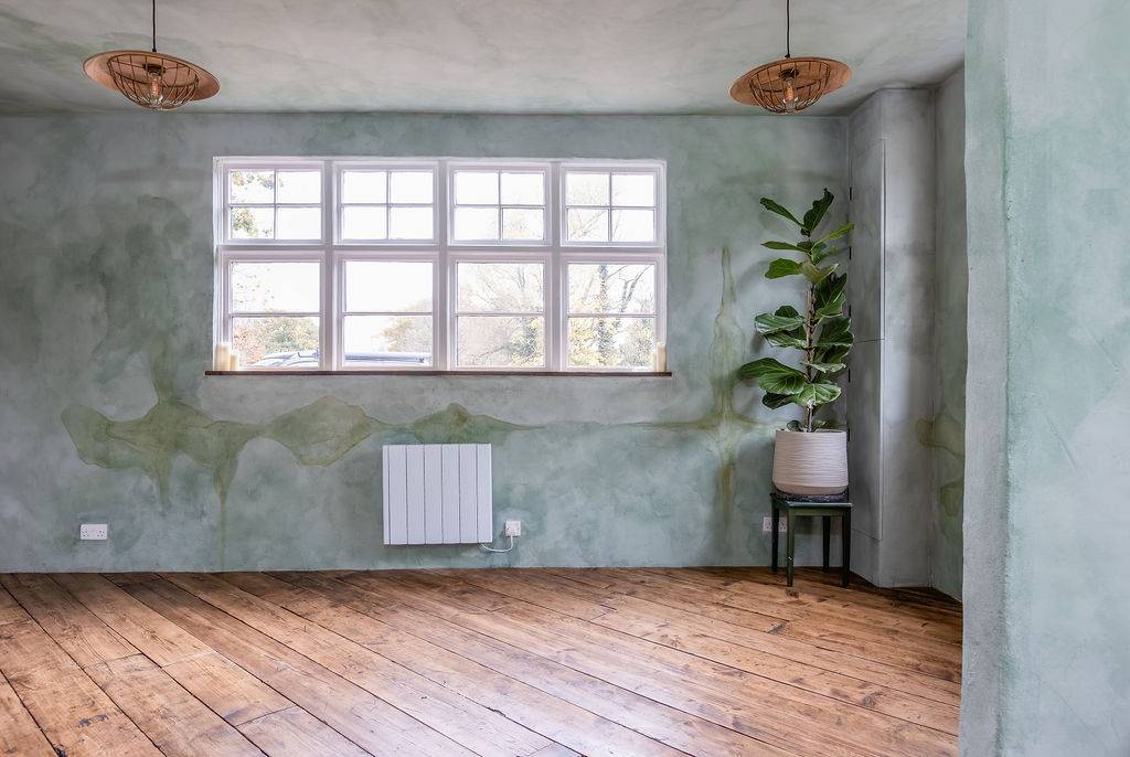 Bright reception room with large windows and painted walls at Love Locations filming location in Liss, Hampshire GU33.