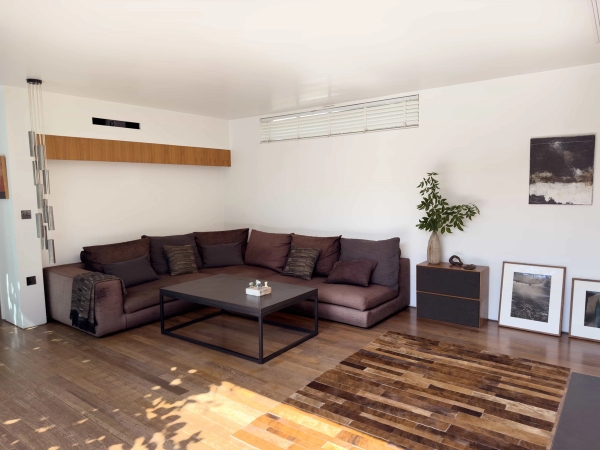 Contemporary lounge space at Love Locations Highgate Zen home with open-plan layout.