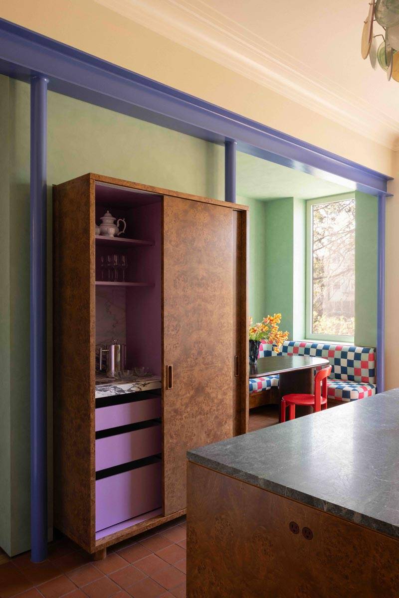 Stylish interior hallway and custom wooden storage doorway transition in a Boerum Hill townhouse production space curated by Love Locations.