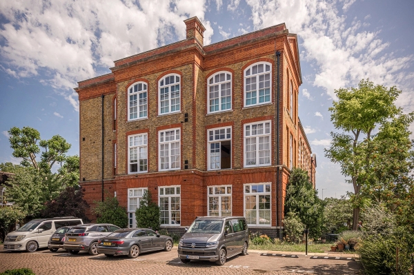 Secure courtyard entrance of a historic converted Victorian school house film location in South London, via Love Locations.