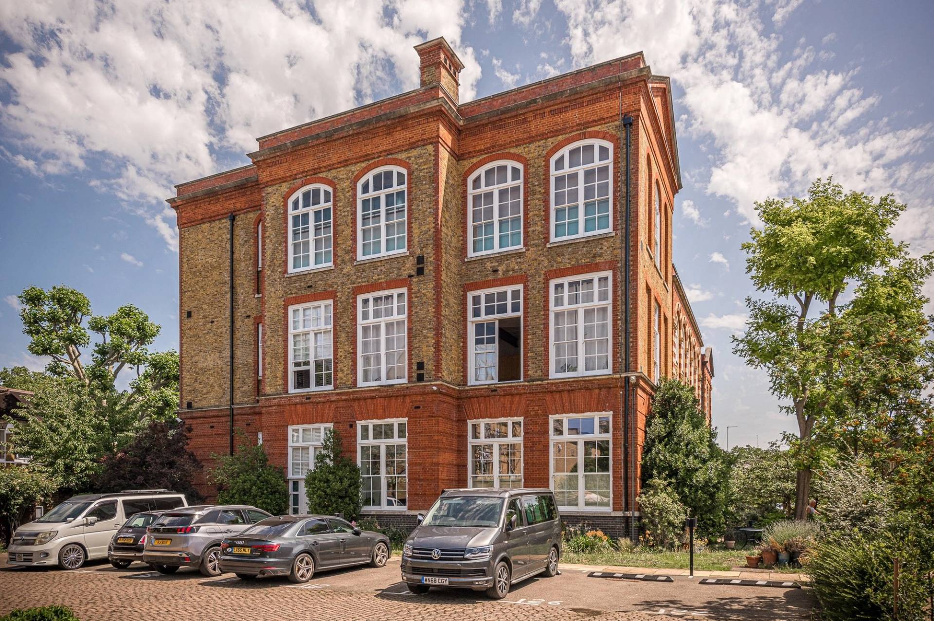 Secure courtyard entrance of a historic converted Victorian school house film location in South London, via Love Locations.