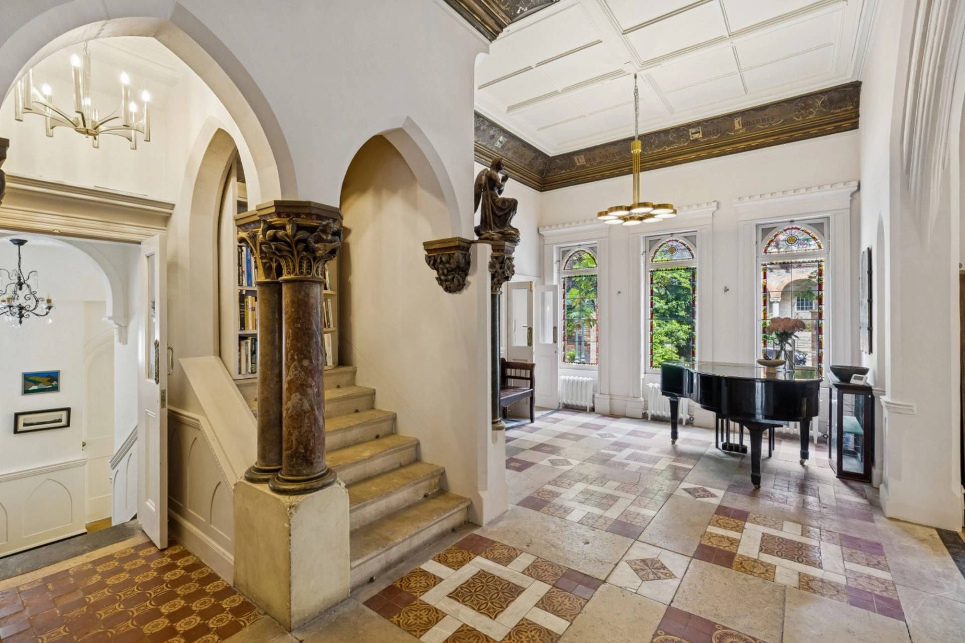 Impressive entrance foyer and stone staircase photoshoot venue in a gothic home in Hampstead NW3 through Love Locations.