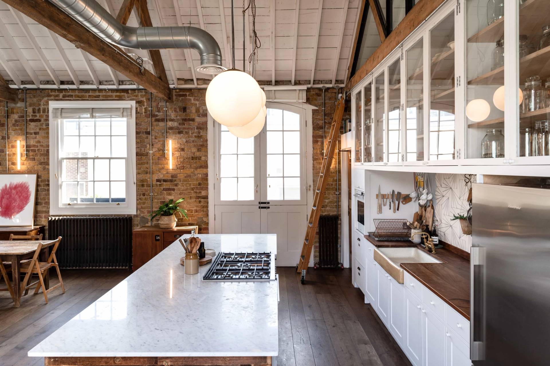Bright kitchen studio with island and seating in Angel North London – love locations