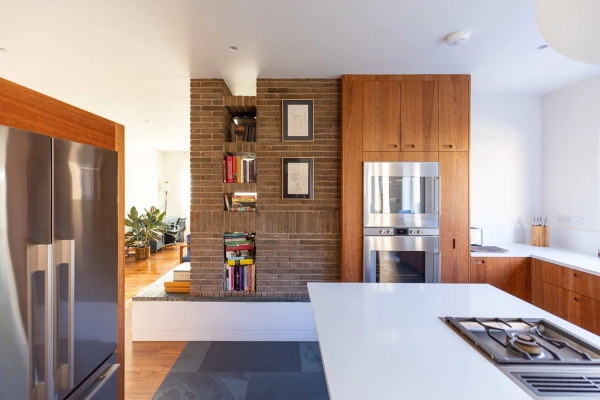 Light-filled living room with timber floors and garden views