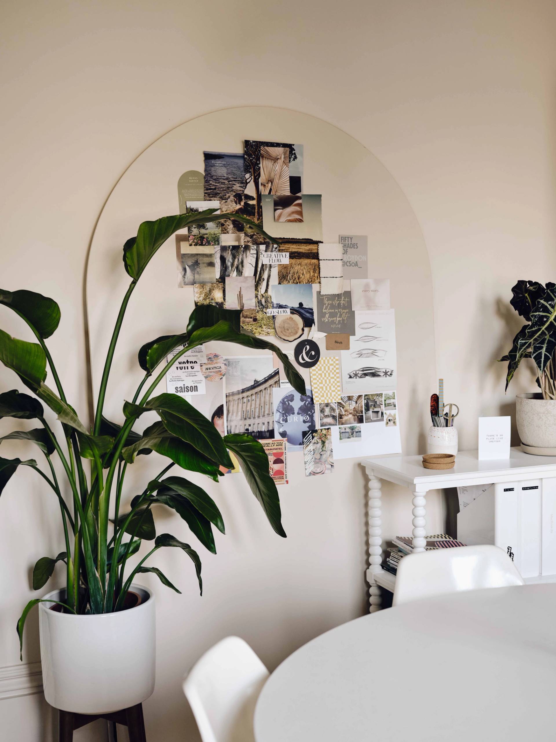 Plaster arch alcove display board styled with mood boards and potted indoor plants, Love Locations CR0.