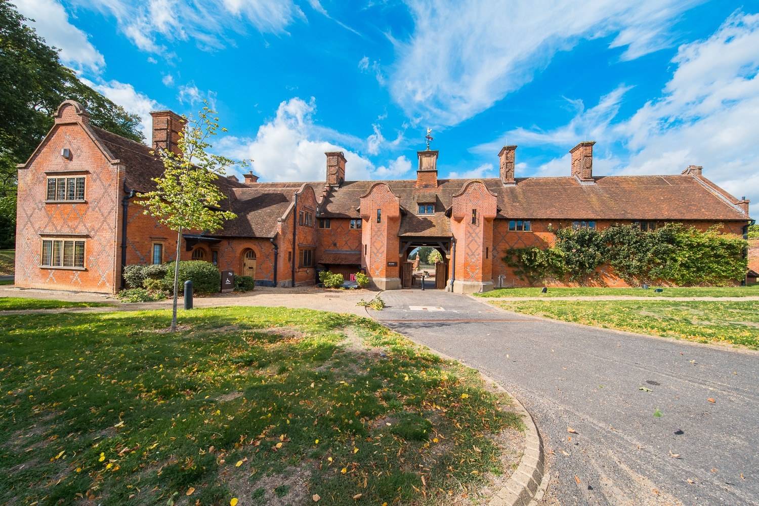 Historic red-brick stable block and courtyard archway at North Mymms Park in Hertfordshire AL9 via Love Locations.