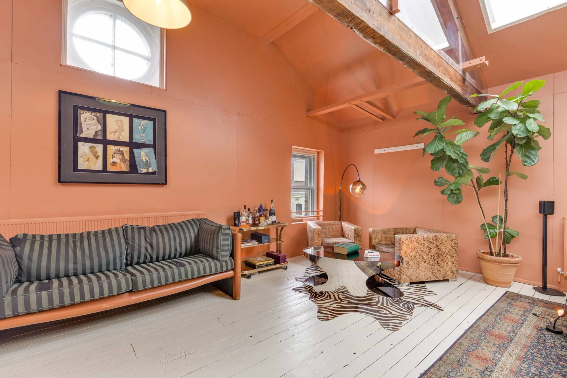 Stylized living room location space with mid-century decor and distinct architectural character, available via Love Locations Richmond.