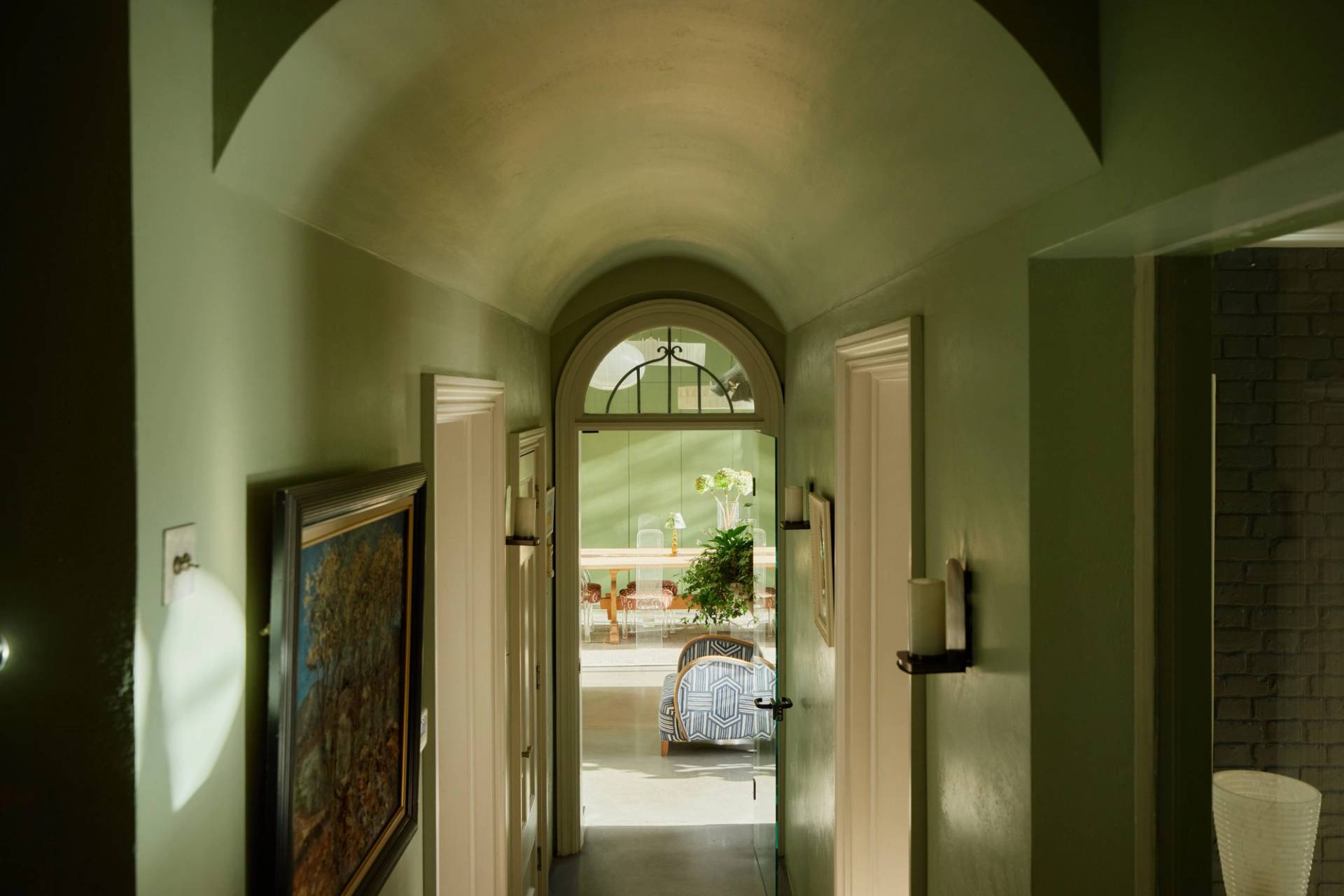 Arched hallway passage with olive green vaulted ceilings and traditional fanlight doors, perfect for period drama filming, Love Locations.