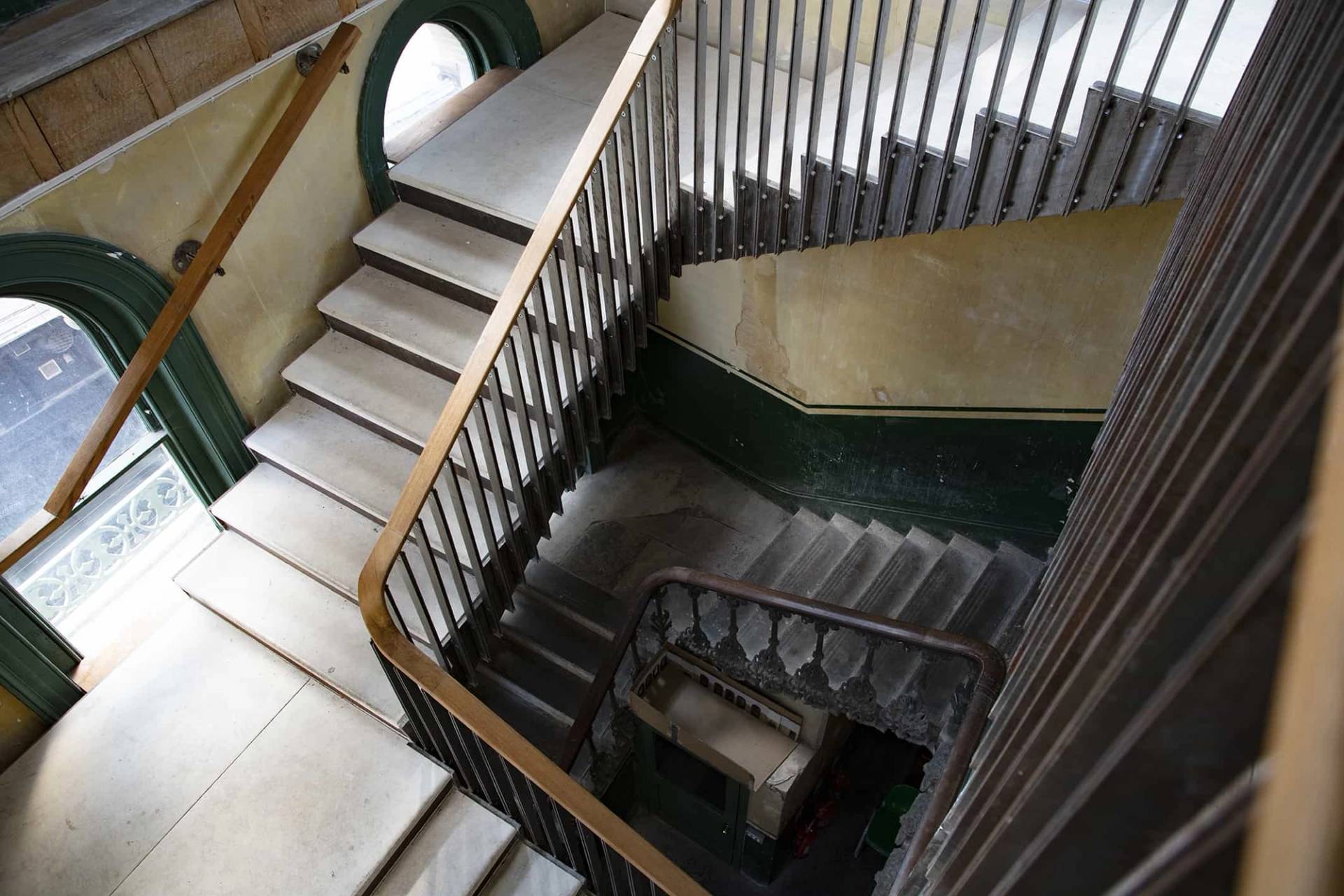 Vintage metal staircase in South East London’s Old Waiting Room, an atmospheric derelict venue ideal for wedding photography, fashion shoots, and creative installations.