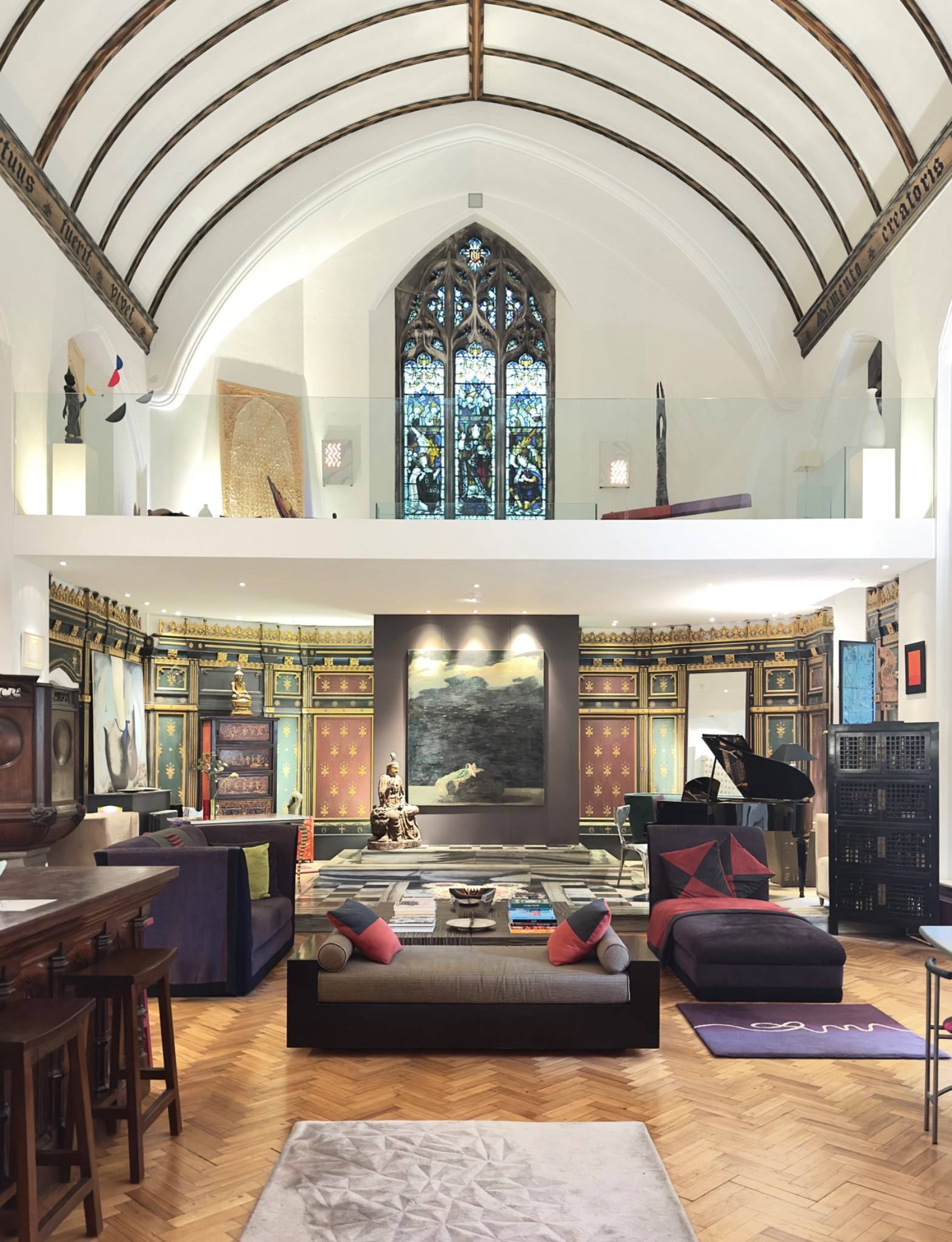Grand living room space for media production in a unique chapel location house in Oval SE5 through Love Locations, highlighting vaulted timber beams and expansive parquet flooring.