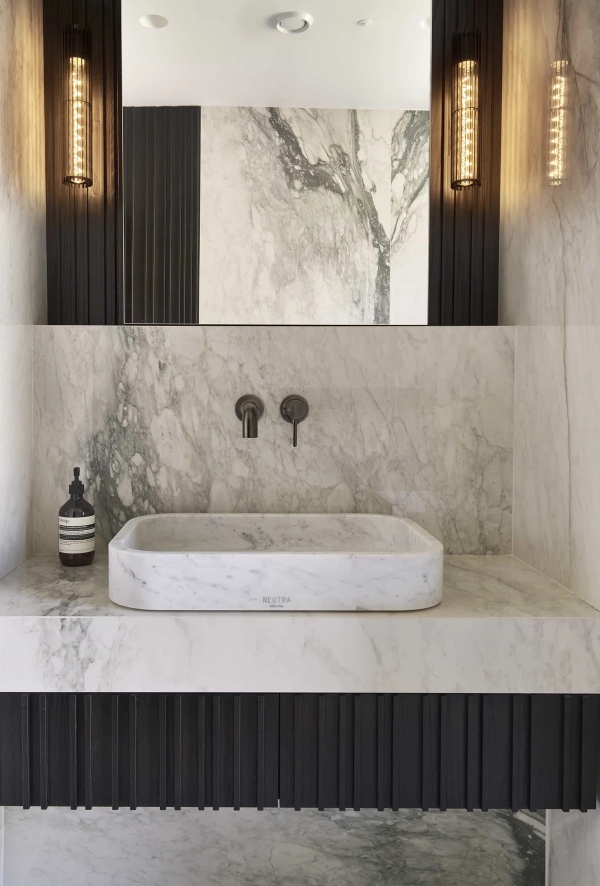 Bespoke solid marble washbasin and contemporary bathroom design for high-end brand campaigns, listed on Love Locations.