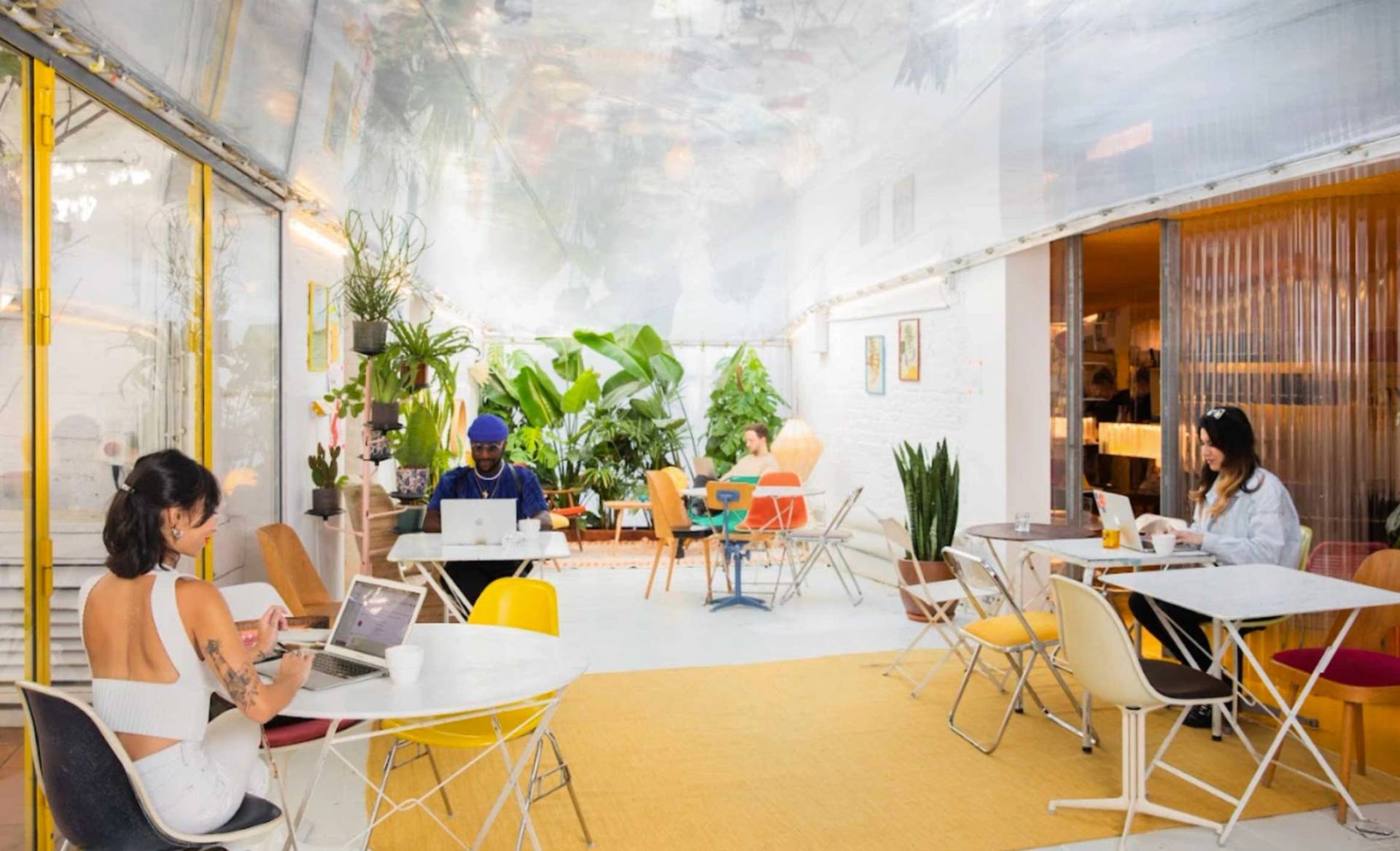Bright W11 London workspace with flexible layout, breakout areas and yellow staircase – love locations