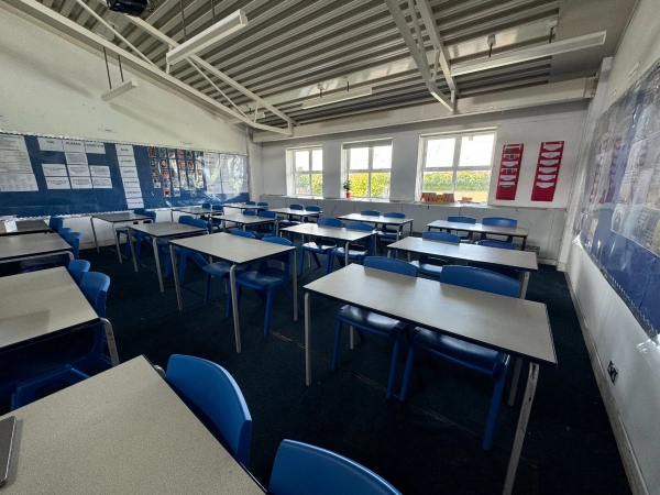 Love Locations school classroom shoot space Cockfosters EN4: Daylight learning space with modular student desks and window shutters, tailored for family brand commercials and TV dramas.