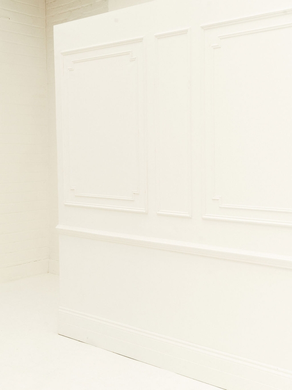 Stylish white panelled wall event backdrop at Brixton Warehouse Love Locations, perfect for weddings and corporate gatherings.