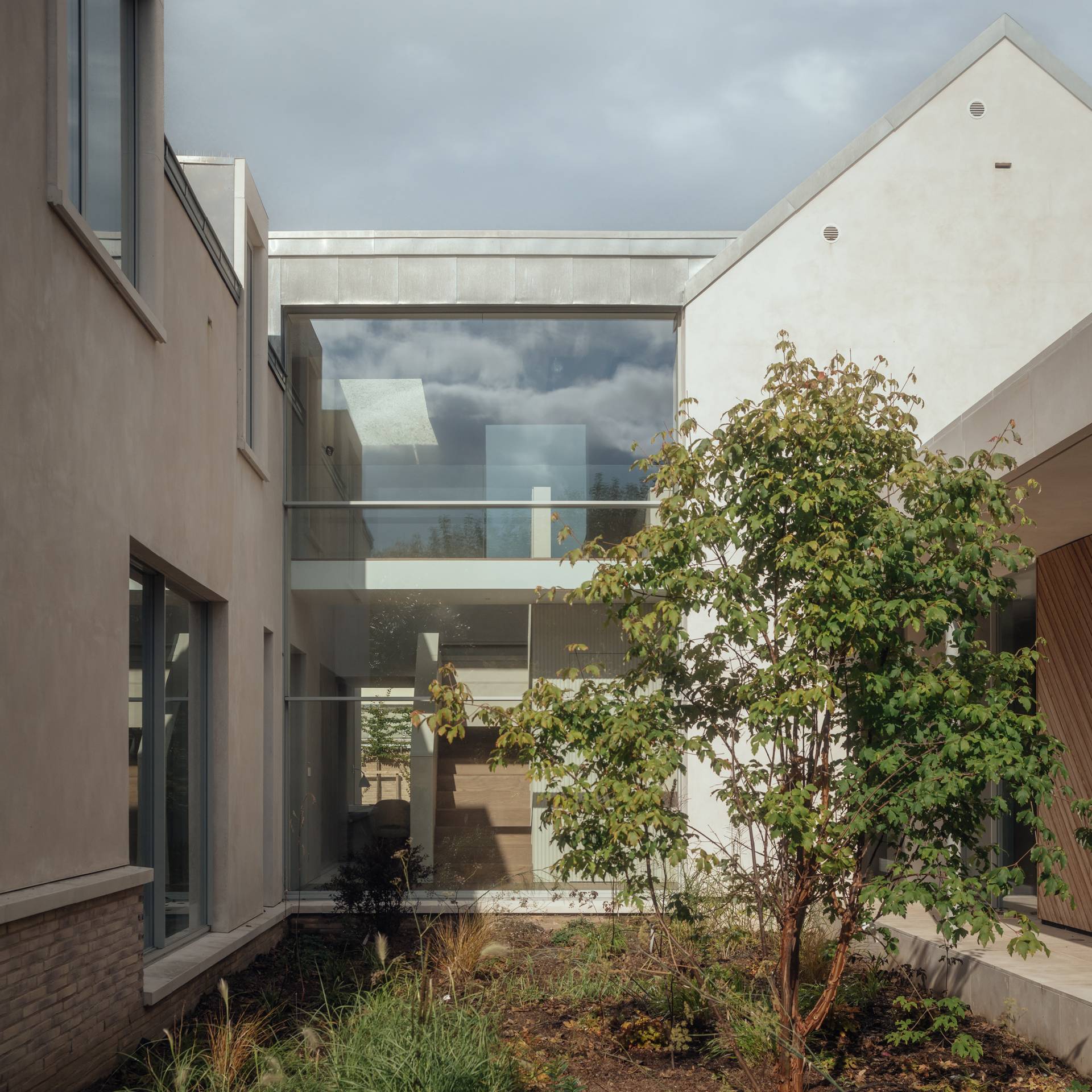 Upper-level glass bridge link connecting two architectural wings of a modern rural home, suitable for high-concept commercial shoots, Love Locations SO20.