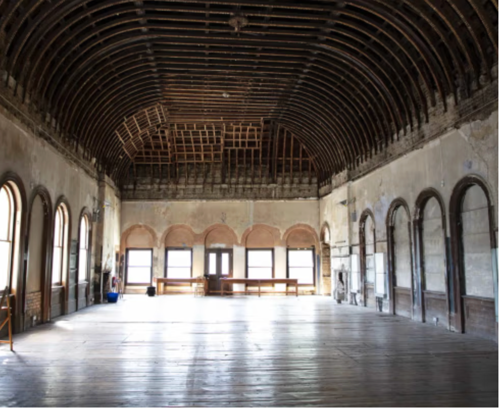 Historic Old Waiting Room venue in Peckham with vaulted timber ceiling, exposed beams, arched windows and original architectural features, ideal for Christmas parties and festive event hire.