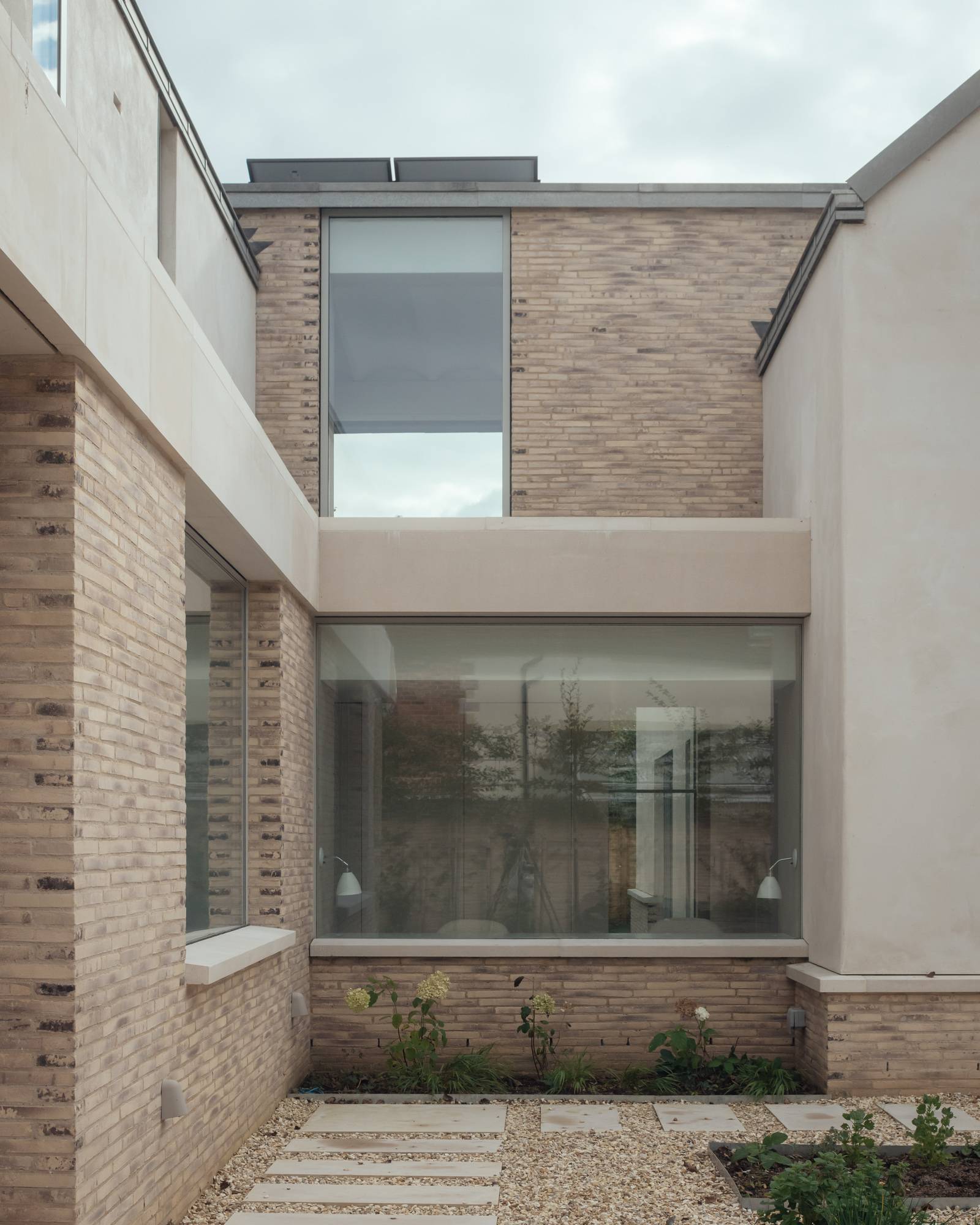 Modern glass-enclosed inner courtyard area in a Hampshire luxury home, Love Locations.