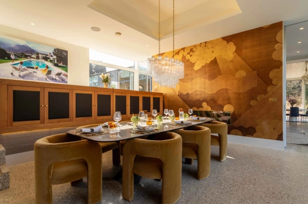 Love Locations luxury house shoot location Godalming Surrey GU8: High-end dining room featuring plush velvet chairs and a metallic gold textured statement wall, perfect for television dramas and commercial filming.