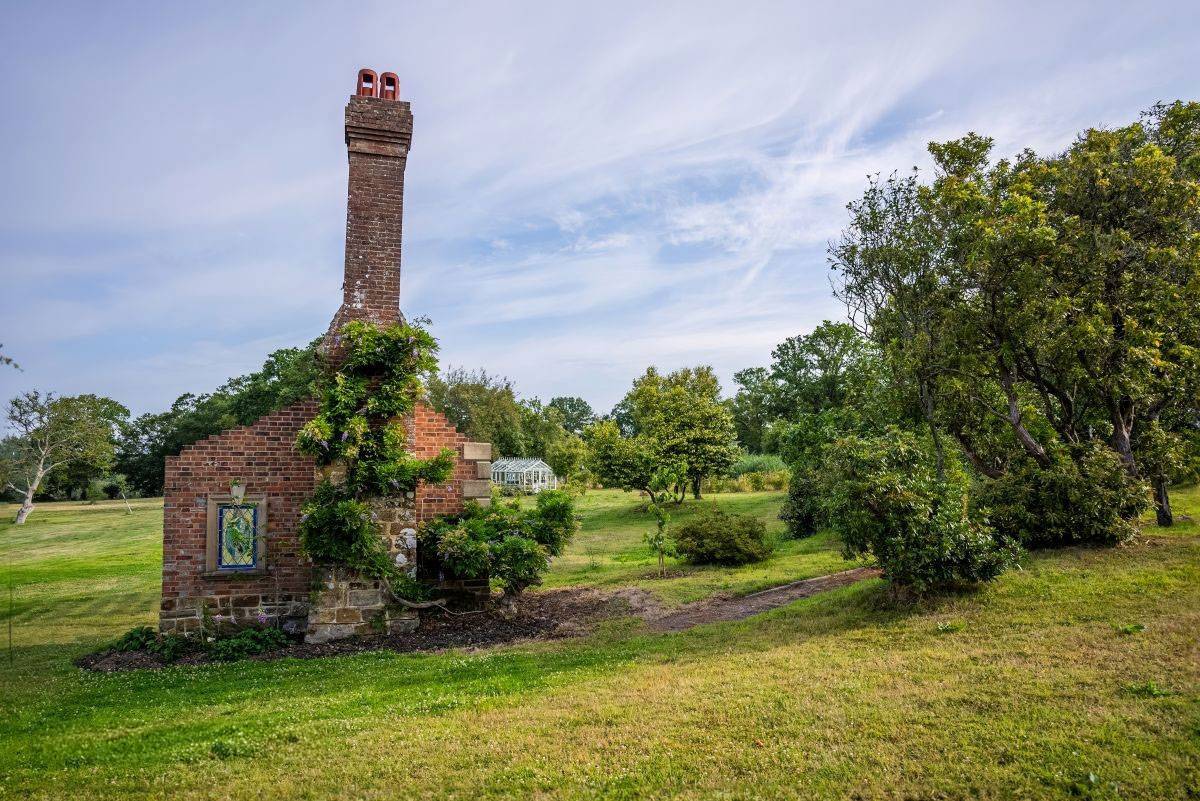 Characterful historic brick folly and chimney stack ruins set within the wilder estate grounds, unique shoot location via Love Locations.