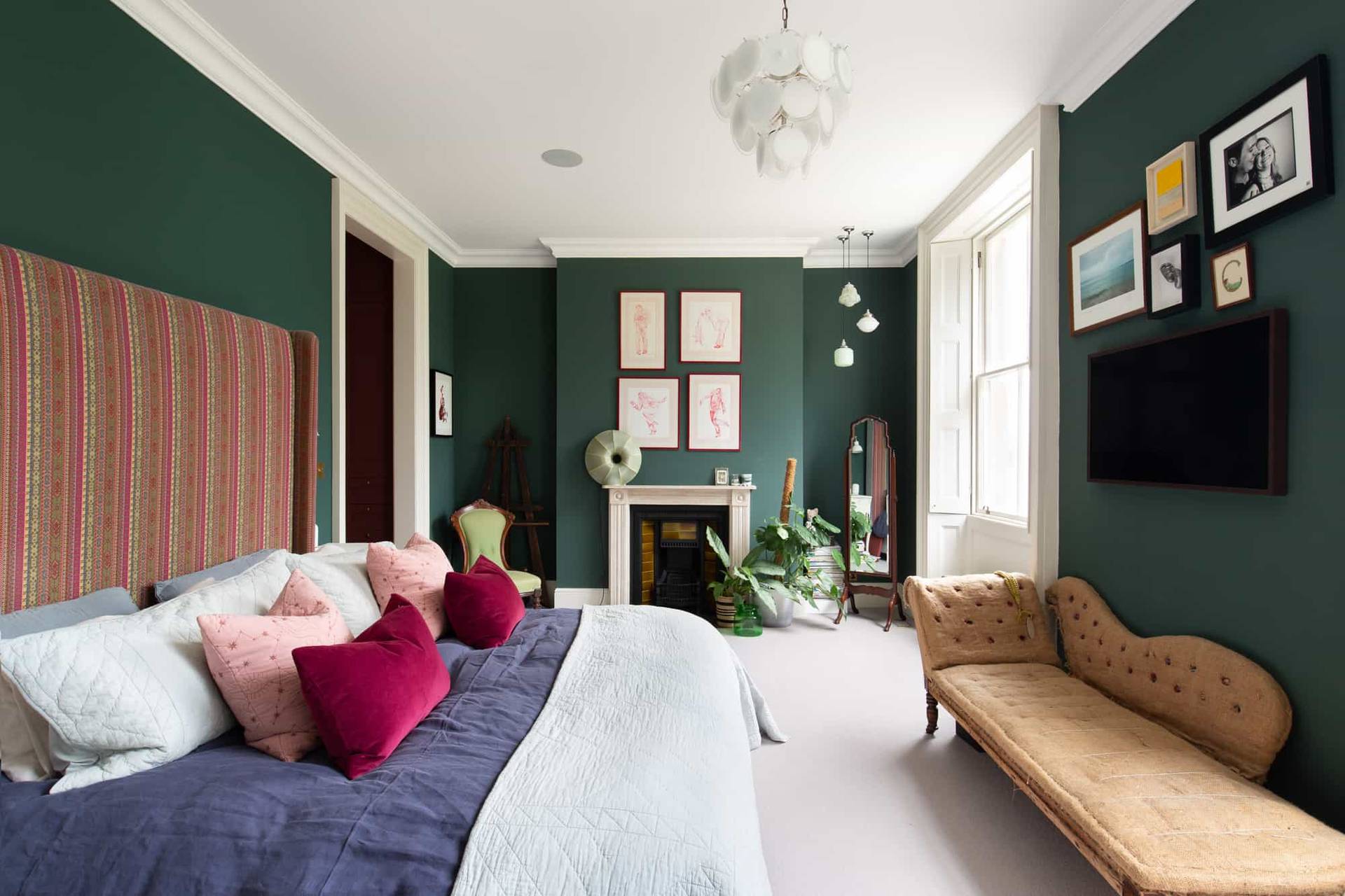 Dark green bedroom location in Camberwell, SE5 with sash windows, velvet sofa, and neutral carpet via Love Locations.