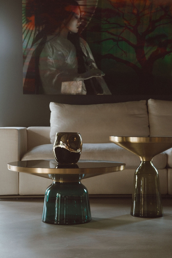 Lounge room detail view featuring a white sofa, brass coffee tables, and large framed artwork, Love Locations 07630.