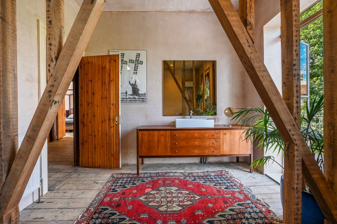 Mid-century modern timber bathroom vanity unit with a vessel sink and large square mirror, ideal for beauty editorials, Love Locations.