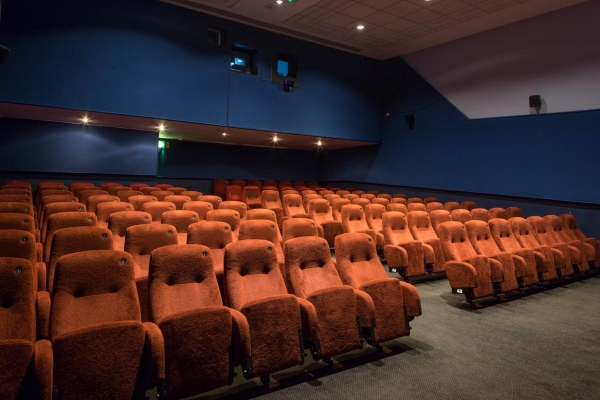 Broad interior view of the red velvet auditorium seating and surrounding acoustic wall panels at The Ritzy Screen 3 cinema venue in Brixton SW2 from Love Locations.