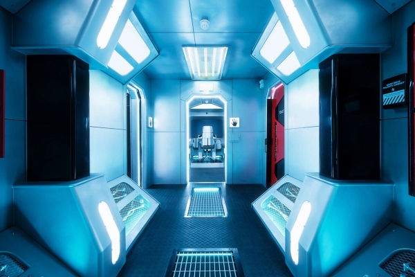 Futuristic spaceship corridor set with bright blue LED panel lighting for sci-fi filming at Albert Embankment, London SE1, via Love Locations.