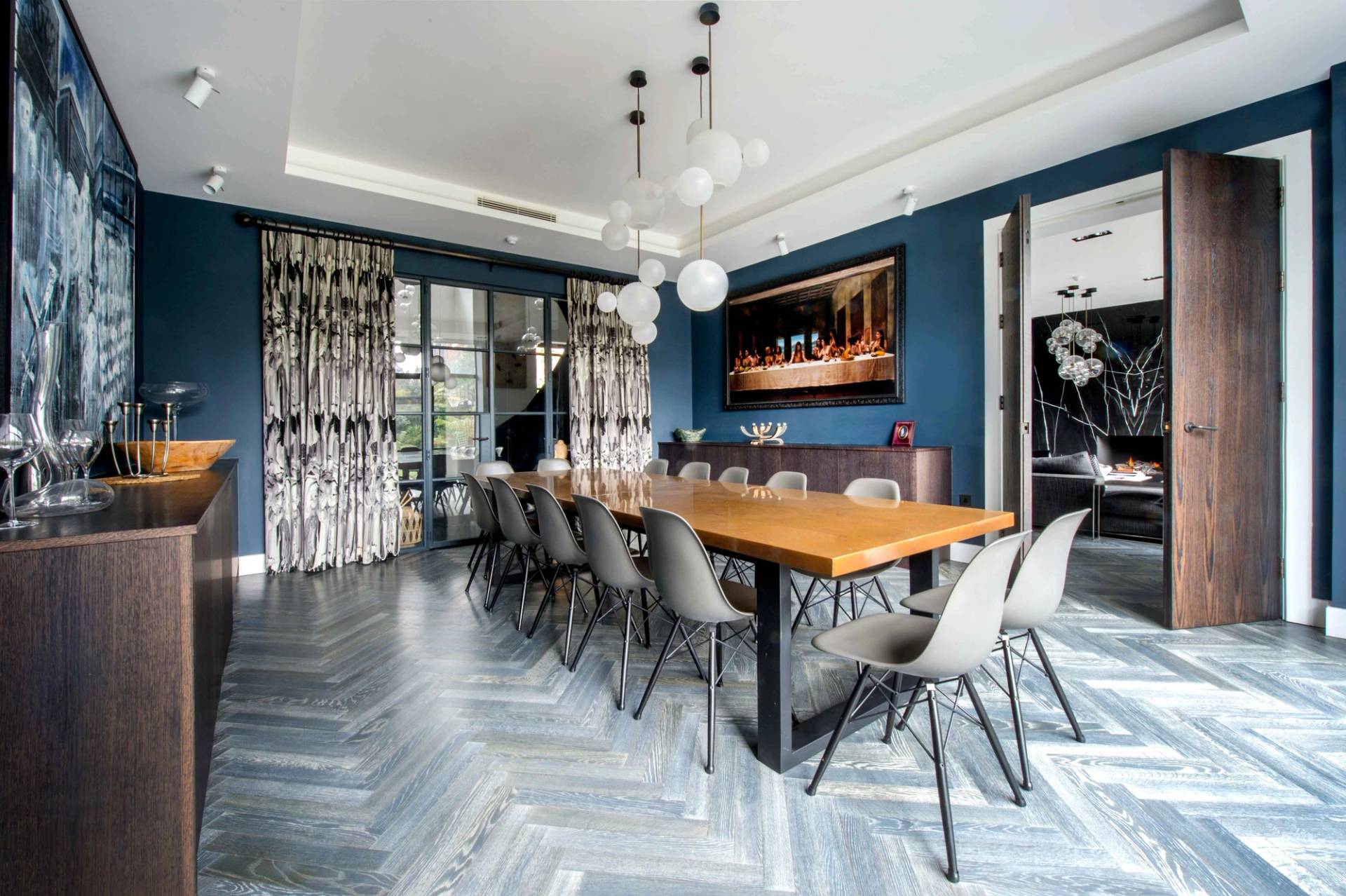 Elegant dining area showcasing a contemporary wood-top table and statement lighting, ideal for food and lifestyle brand advertising, Love Locations.