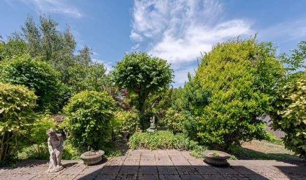 Period hotel building in West London with layered interiors and garden space