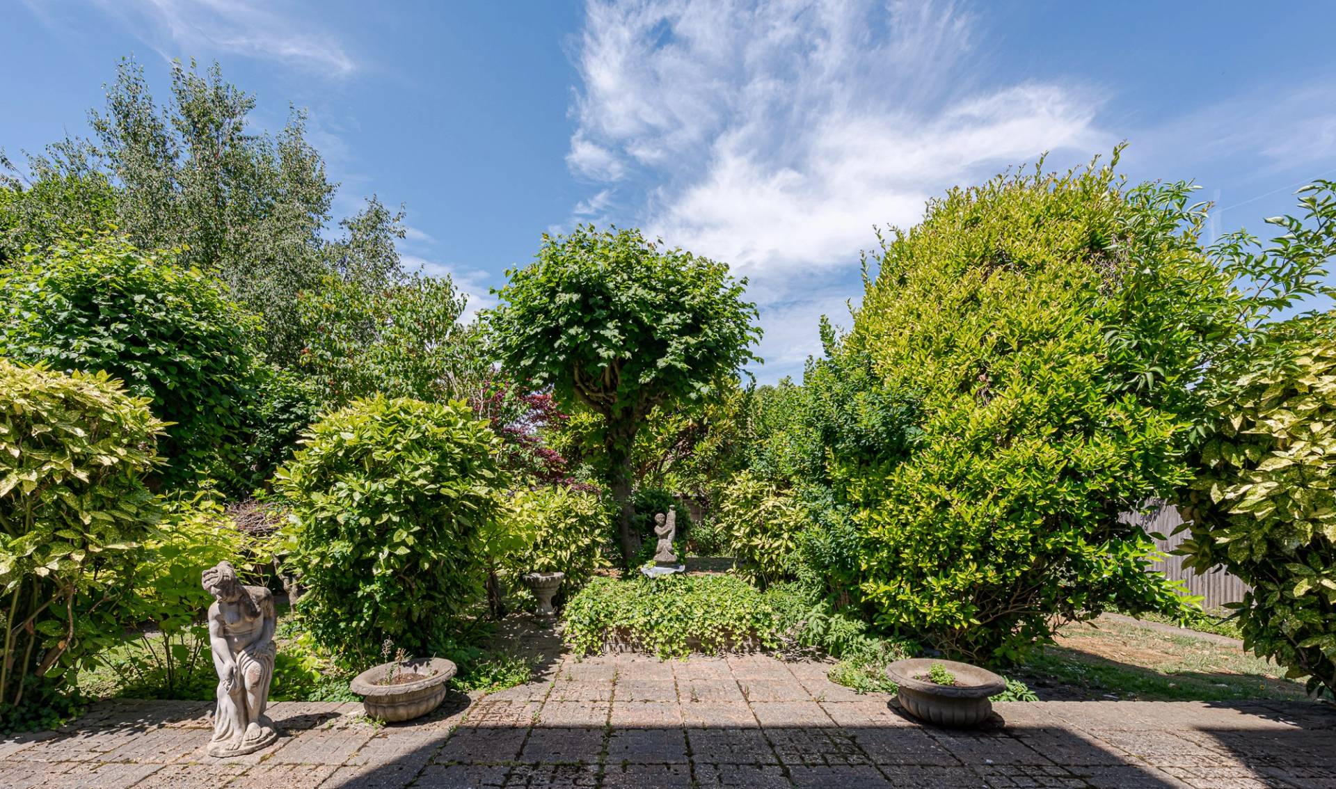 Period hotel building in West London with layered interiors and garden space