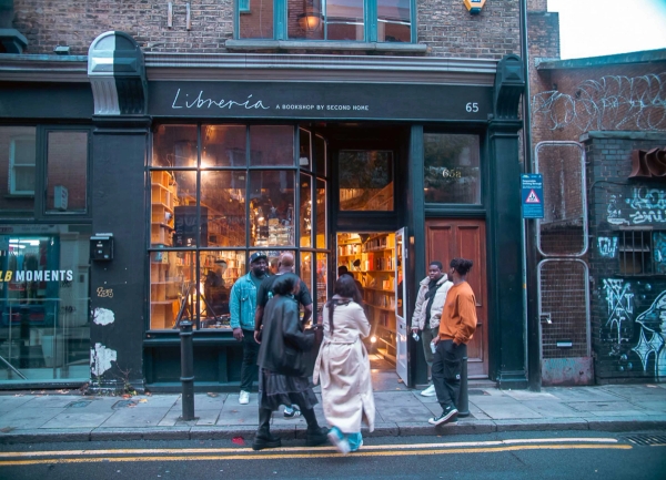Bright East London bookshop with floor-to-ceiling shelving and social layout in E1 – love locations