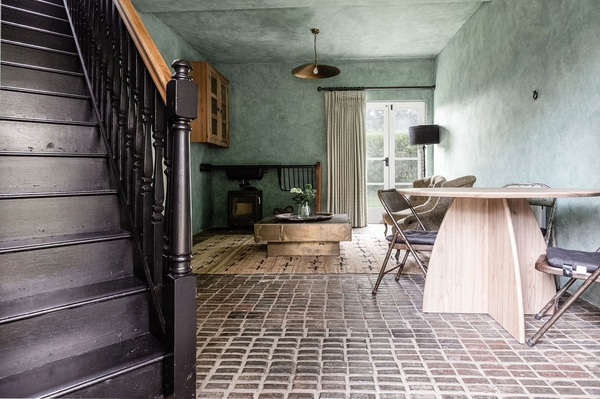 Hallway with staircase, exposed brick flooring and period features at Love Locations in Liss, Hampshire GU33.
