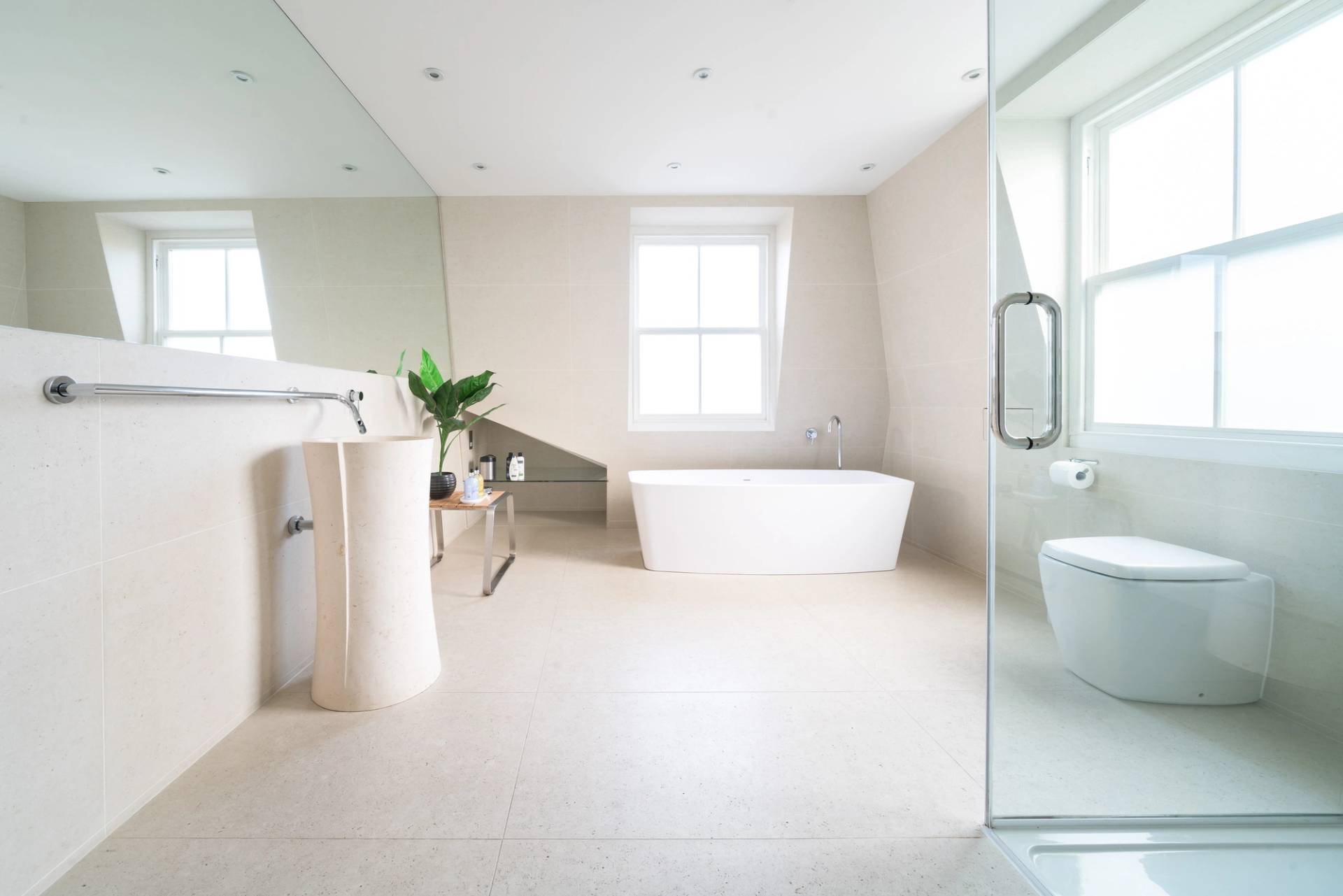 Spacious master ensuite featuring a soaking tub, glass walk-in shower, and sash window light, Love Locations SW6.