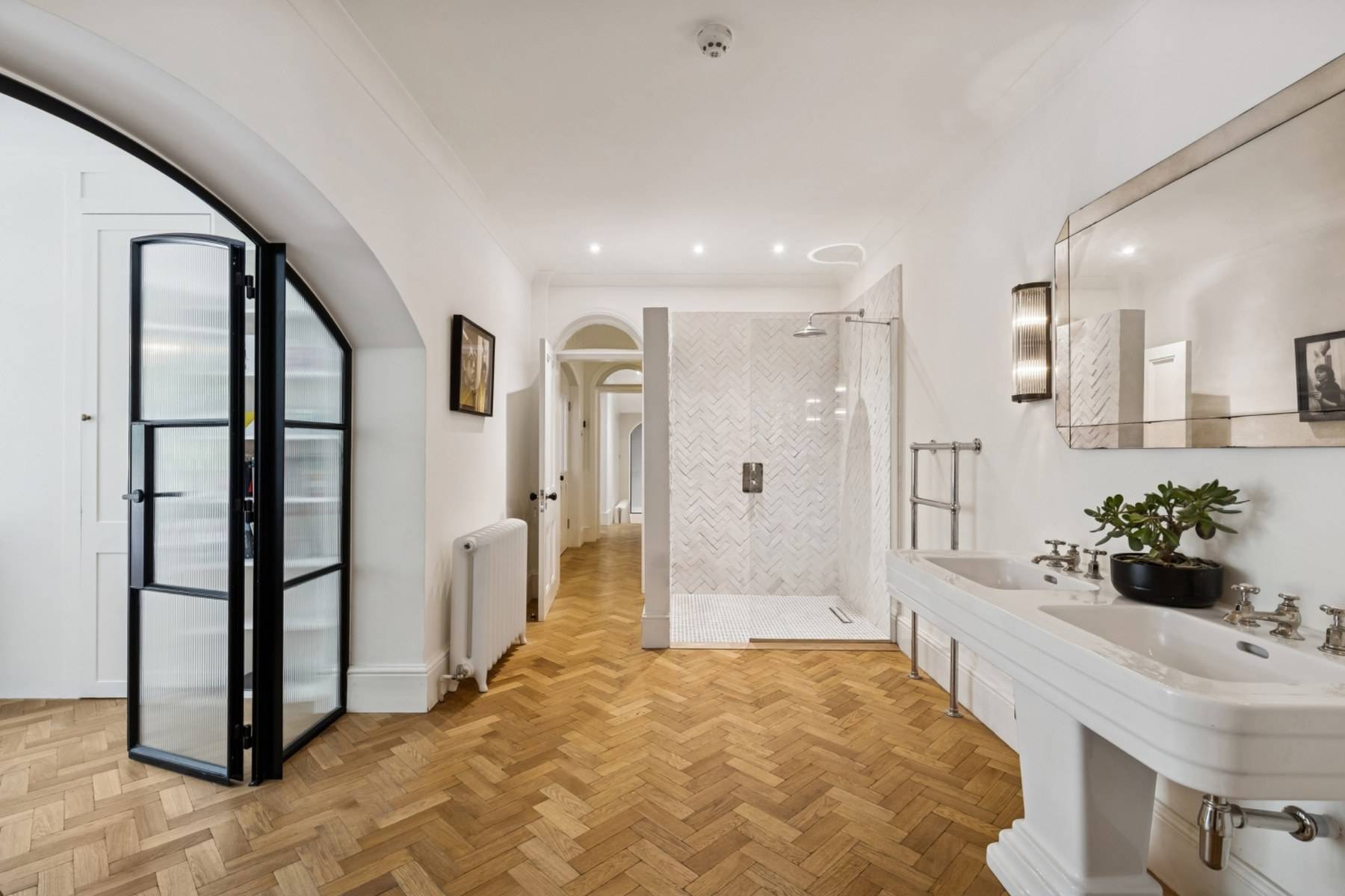 Luxury bathroom film location with glass walk-in shower and parquet floor in Hampstead NW3 via Love Locations.
